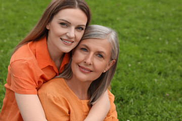 Fototapeta premium Happy mature mother and her daughter outdoors