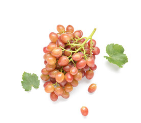 Tasty ripe grapes and leaves on white background