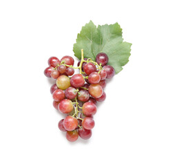 Tasty ripe grapes with leaf on white background