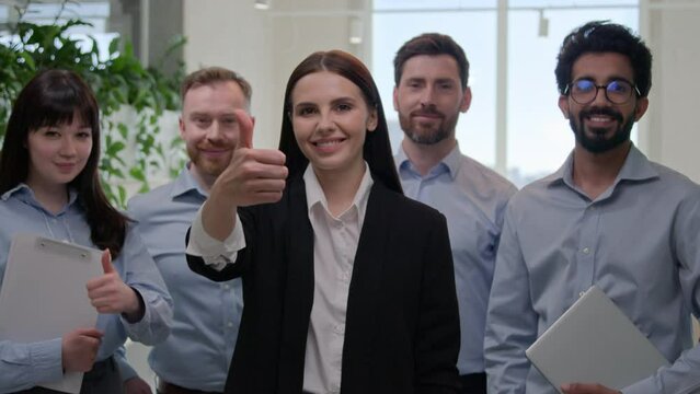 Portrait happy office group diverse multinational business people with corporate team leader show thumbs up gesture at camera smiling businessmen businesswomen approve great recommendation good sign
