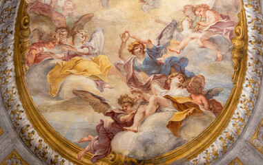 GENOVA, ITALY - MARCH 8, 2023:  The angels in the glory - fresco in the side chapel of church...