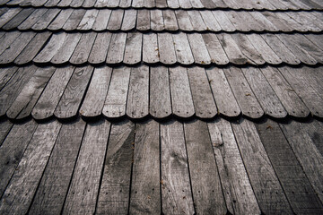 Unpainted wooden roof tiles, gray natural wooden surface texture background