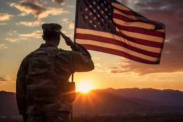 American soldier saluting the american flag during sunset