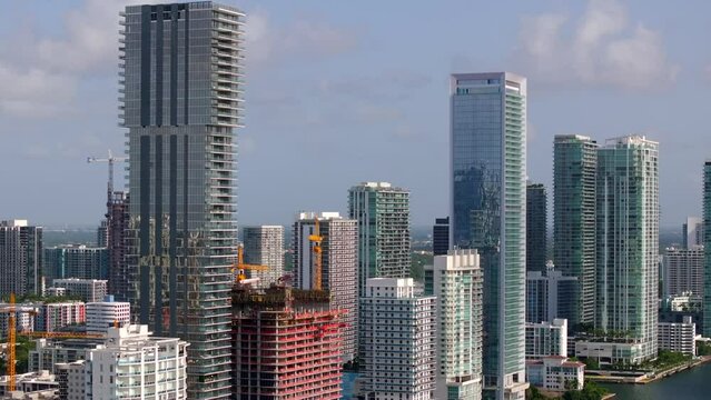Aerial telephoto parallax video Miami highrise buildings Summer 2023