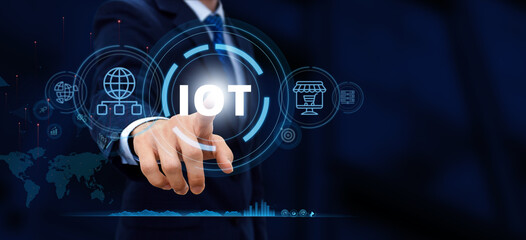 Fototapeta premium Internet of things - IOT concept. Businessman touch IOT products and solutions.