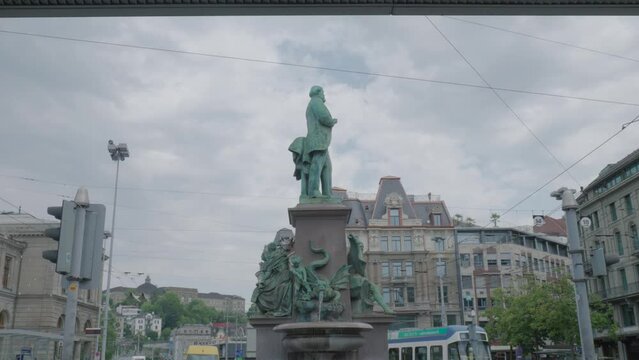 Bronze Statue Of Alfred Escher In The Fountain Monument In Zurich, Switzerland. Wide Shot