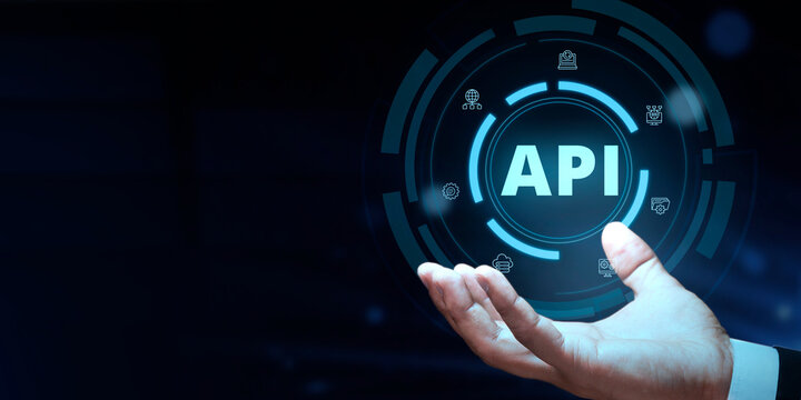 API - Application Programming Interface. Business  modern technology  internet and networking concept. Businessman Hand holding the icon.