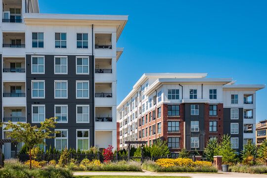 Brand New Apartment Building On Summer. Canadian Modern Residential Architecture. Modern Complex Of Apartment Buildings