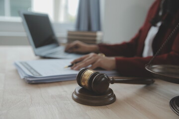 Business and lawyers discussing contract papers with brass scale on desk in office. Law, legal...