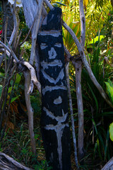 Carved totem in black ash