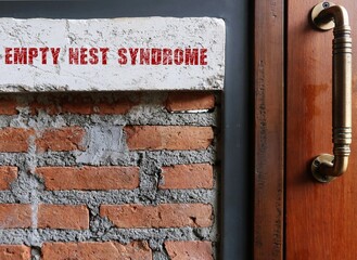 Wood door with text on vintage brick wall written EMPTY NEST SYNDROME - phenomenon which parents sad lonely feelings of loss when the last child grows and leaves home