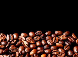 Top view delicious coffee beans on orange background