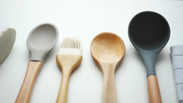  wooden cutlery fork and spoon on a chopping board on table 