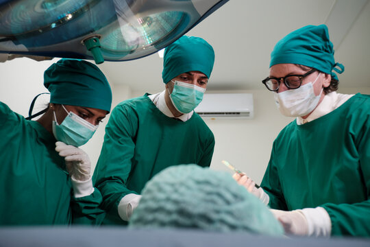 Specialist surgeons teams, professional doctor with assistants, surgery operations on critically ill patients in hospital's ICU, and coma paramedic treatment, safety rescue.