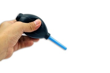 A hand holding an air blower isolated on white background with clipping path, clening concept.