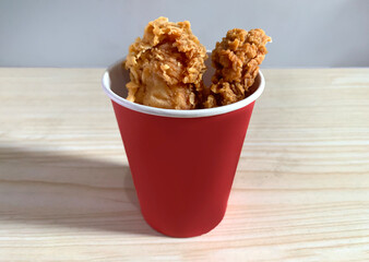Crispy Fried Chicken Skins in red paper cup