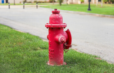 Fototapeta na wymiar Fire hydrant stands ready, a symbol of safety, preparedness, and vital connection to quenching emergencies on city streets