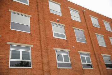 brick building embodies solidity and growth in commercial real estate; a symbol of stability, prosperity and lasting business success