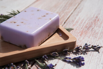 Lavender soap on a vintage white wooden board.