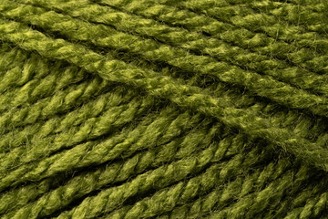 Micro close up of green wool threads with copy space