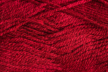 Micro close up of red wool threads with copy space