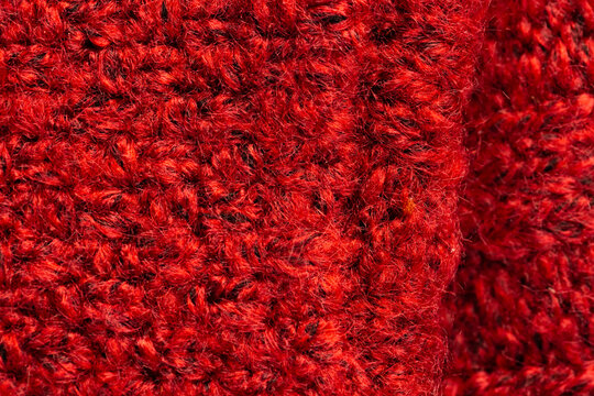 Fototapeta Micro close up of red wooly crochet fabric with copy space