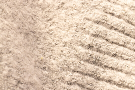 Fototapeta Micro close up of beige wooly knitted fabric with copy space