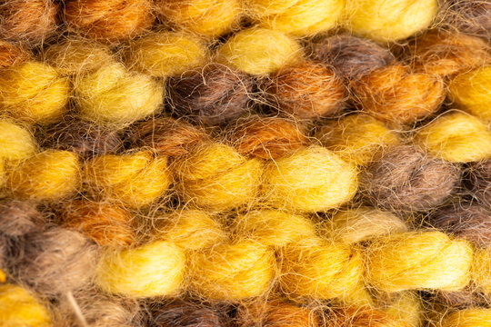Fototapeta Micro close up of yellow knitted woolly fabric with copy space
