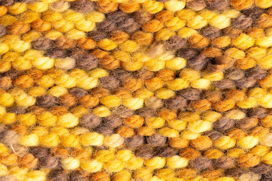 Fototapeta Micro close up of yellow knitted woolly fabric with copy space
