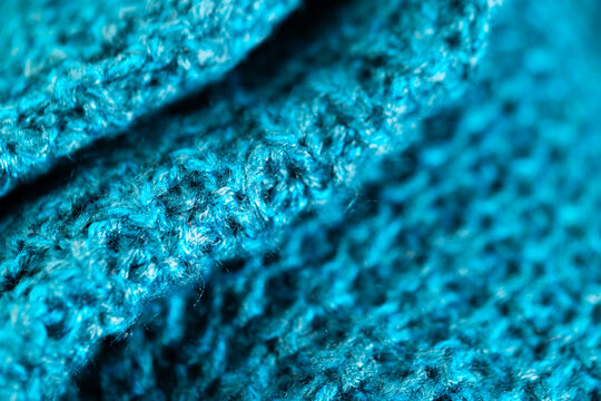 Fototapeta Micro close up of blue crocheted woolly fabric with copy space