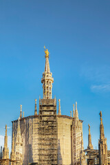 The Madonnina is a statue of the Virgin Mary atop Milan Cathedral