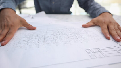 consideration of the plan of the house, close-up