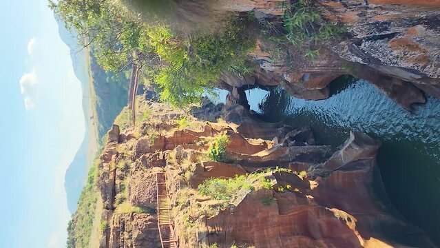 Vertical pan from rocky cliffs above Burke&rsquo;s Potholes, Blyde Canyon, South Africa