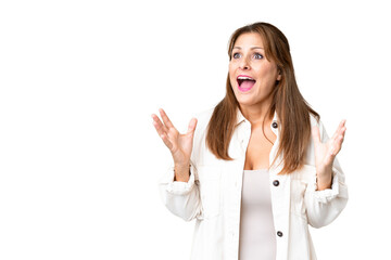 Middle age woman over isolated background with surprise facial expression