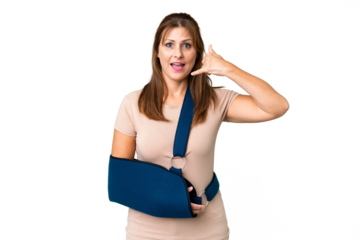Middle age with broken arm and wearing a sling over isolated background making phone gesture. Call me back sign