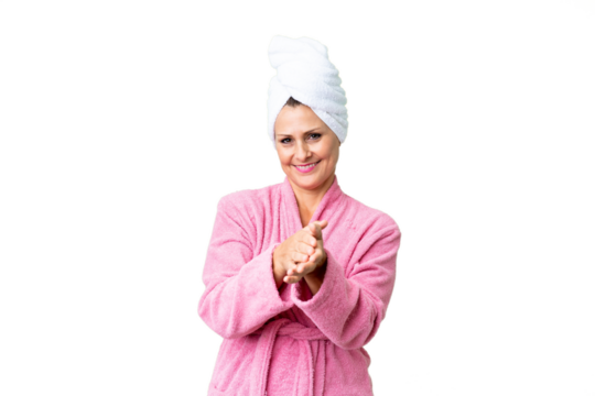 Middle age caucasian woman in a bathrobe over isolated background applauding after presentation in a conference