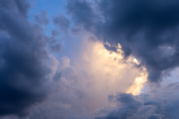 Dark blue sky with white clouds background blue cloud texture Dark blue sky wallpaper with full white clouds and sunlight.