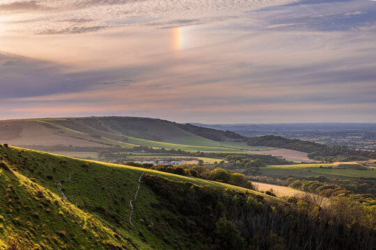 A sundog over Folkington Hill from Combe Hill Butts Brow on the south downs near Polegate east Sussex south east England UK