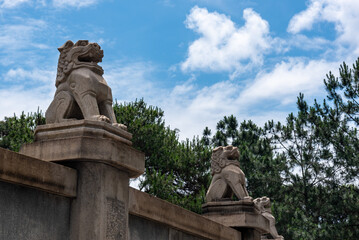 Stone lion sculpture on the Guangzhou Commune Martyrs' Cemetery in china. Historical site and Red tourism sites in china.