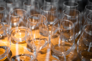 empty clean glass glasses for alcoholic drinks in a restaurant on a bar counter