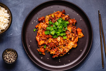 Fried kimchi with pork onions and spices. Traditional Korean food