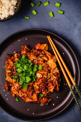 Fried kimchi with pork onions and spices. Traditional Korean food