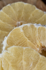 peeled pomelo on the table, close up