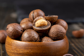 Unpeeled macadamia nuts on the table