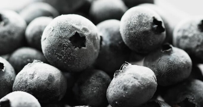 Micro video of blueberries with copy space on white background