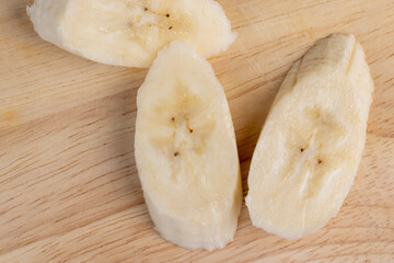a ripe sweet banana cut into pieces lies on the table