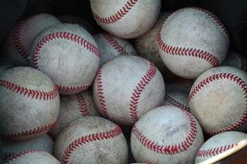 A pile of old baseballs