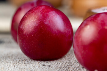 cut into pieces of plums in flavored pink yogurt