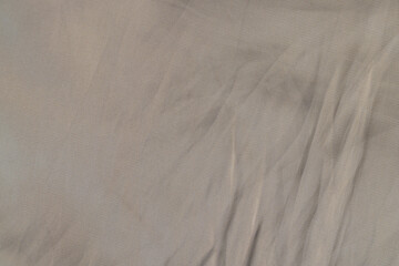 part of the fabric from beige-colored clothing