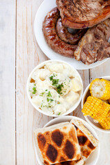 South African Braai Day or Heritage Day. Celebrating traditional braai food.
Meat and sides with...
